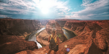 Woman standing on top of canyon